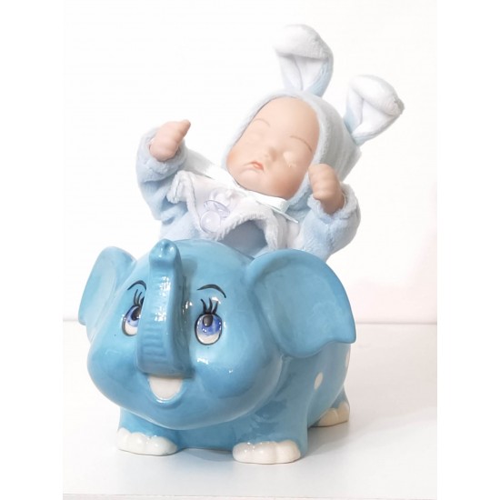 Bébé garçon en porcelaine sur éléphant musical